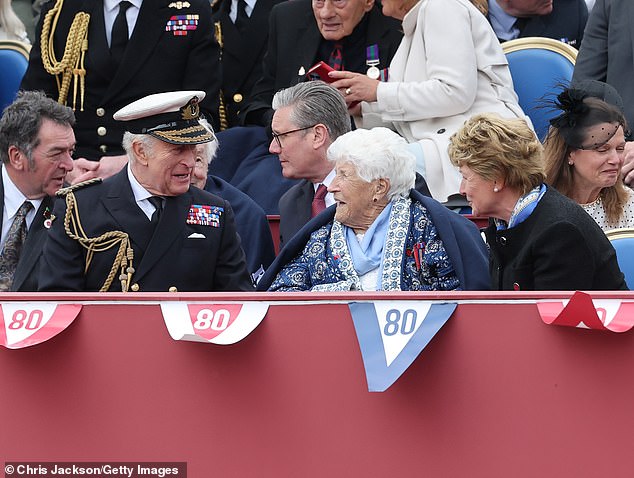 Veteran Joy Trew speaks to King Charles. She was sat between the monarch and Lady Sarah McCorquodale, the elder sister of the late Princess Diana