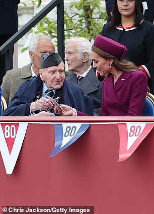 Mr Morgan shows the Princess of Wales a photograph