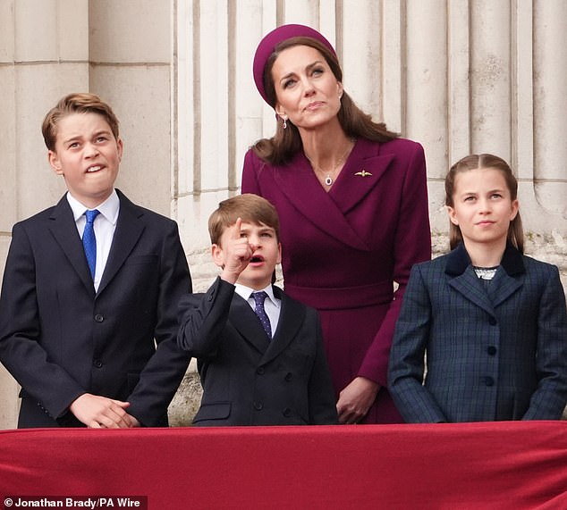 The young prince pointed up as he observed the planes with his family, looking delighted as he did so
