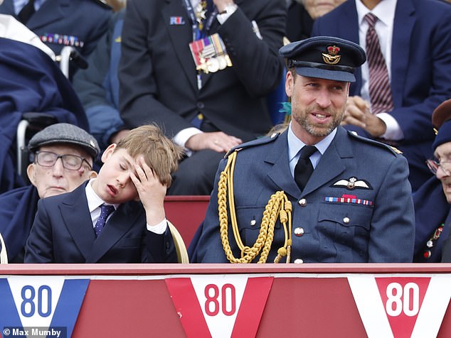 Louis, seven, appeared to have had enough of the festivities as he sat alongside his father