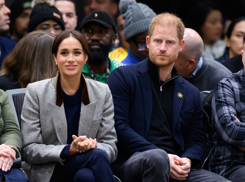 Meghan Markle and Prince Harry at a wheelchair basketball match.
