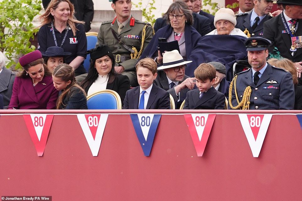 While his family sat and watched the parade, Prince Louis was up to his old tricks as he playfully stuck out his tongue