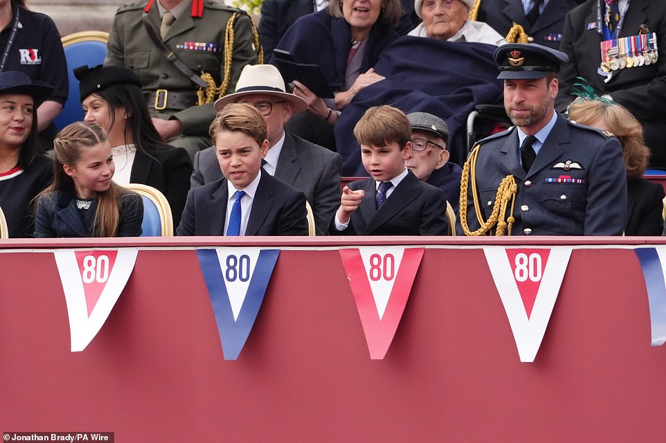 Like father, like son! Prince Louis copying his father's pointing finger gesture at the VE Day celebrations this morning