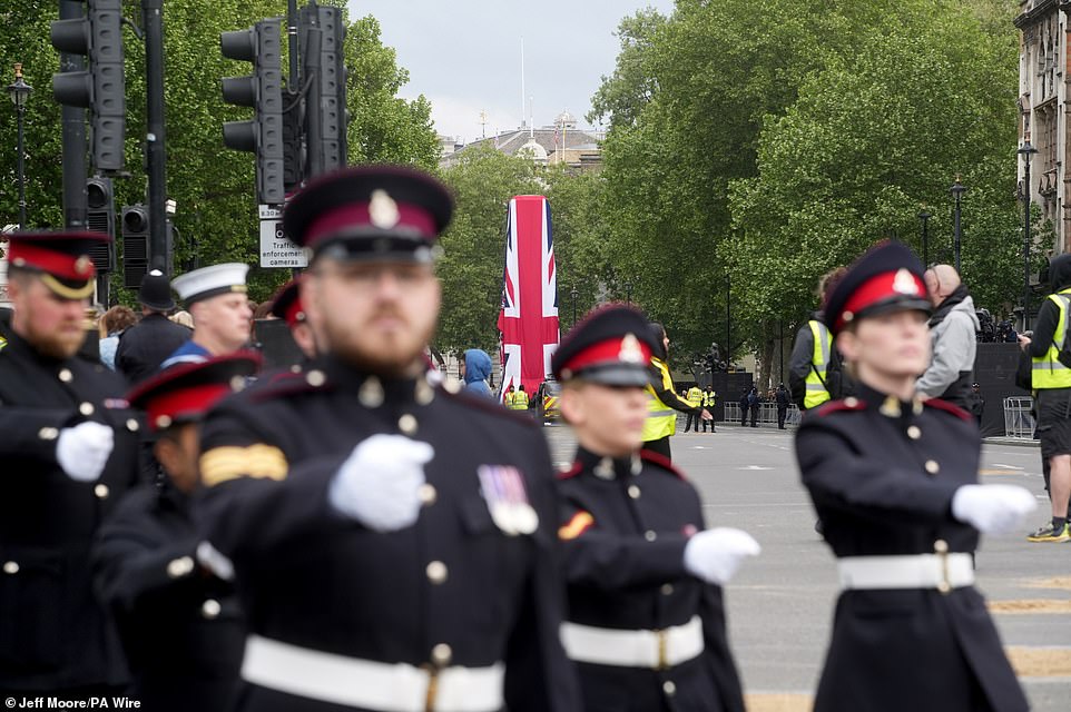Members of the military march near Parliament Squareahead of a military procession marking the 80th anniversary of VE Day