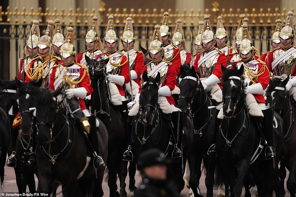 Members of the Household Cavalry Mounted Regiment ahead of the military procession through Central London today