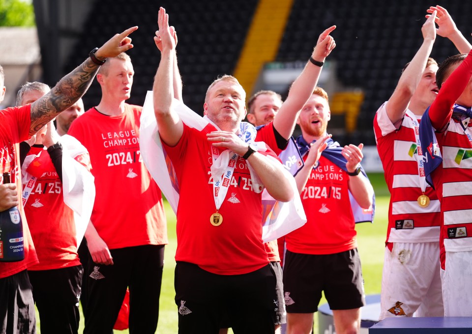 Grant McCann of Doncaster Rovers celebrates winning the league.