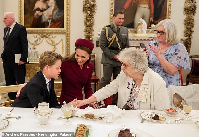 The young prince shook hands with the respected guests in attendance as he was joined by his parents