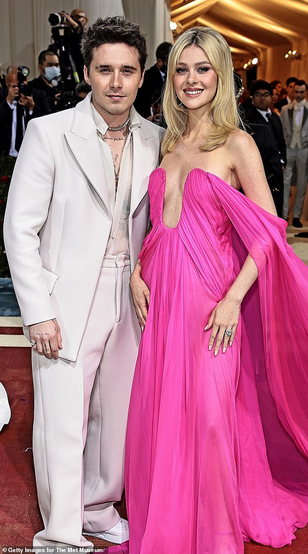 Nicola and Brooklyn attend the 2022 Met Gala in New York. Nicola wears a stunning bright pink dress