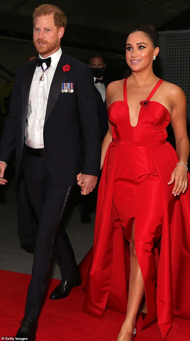 Meghan and Harry at the 2021 Salute to Freedom Gala in New York, with Meghan in a vivid red gown