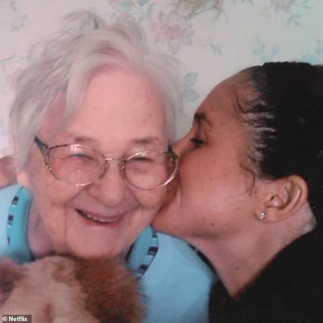 Meghan lovingly giving her late grandmother Doris a kiss on the cheek in a photo shared in her Netflix documentary