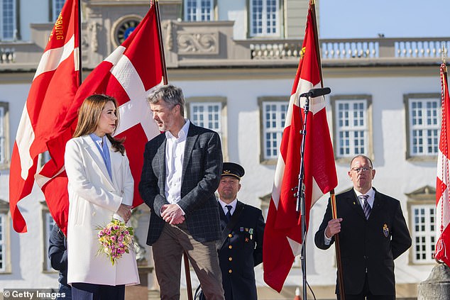 Mary held onto a bouquet of flowers as she and her husband both greeted members of the public, and enjoyed chatting