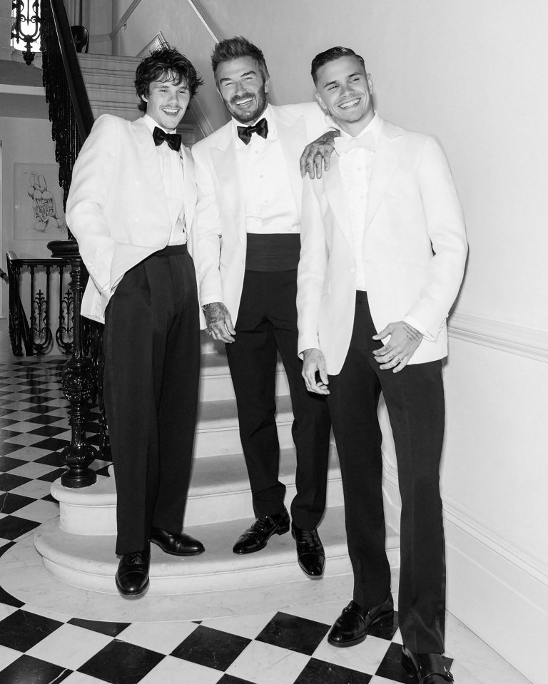 Black and white photo of three men in white tuxedos.