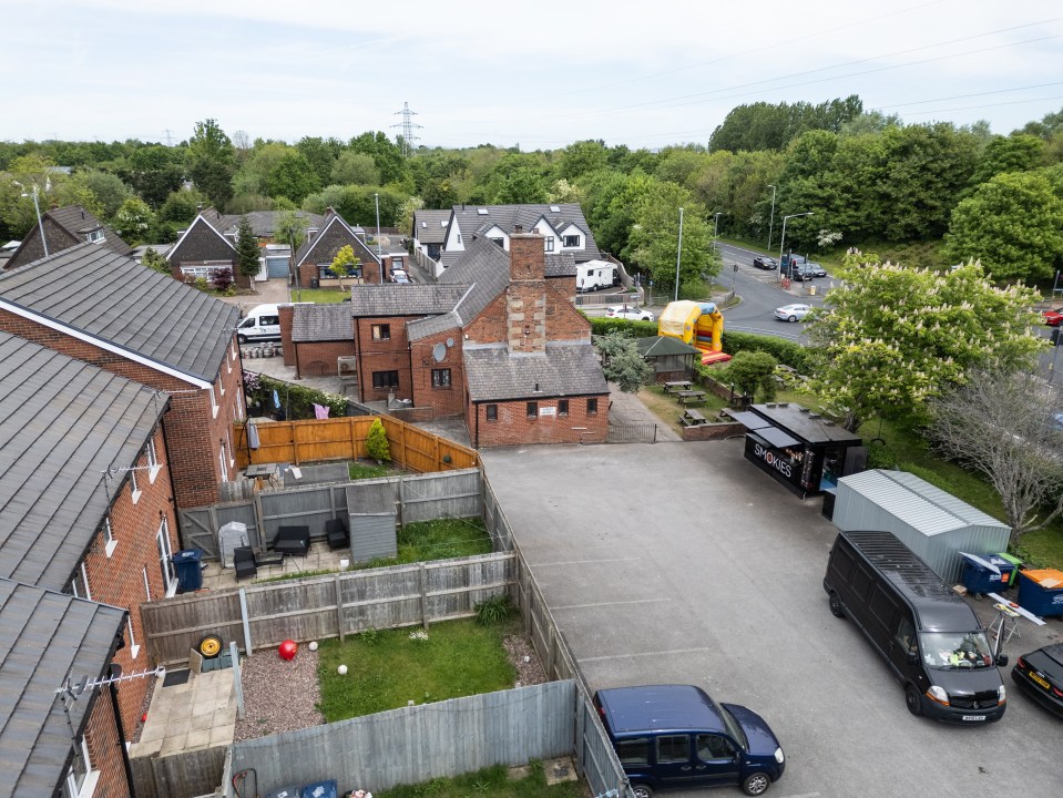 Aerial view of a smash burger van and surrounding area, including houses and a pub.
