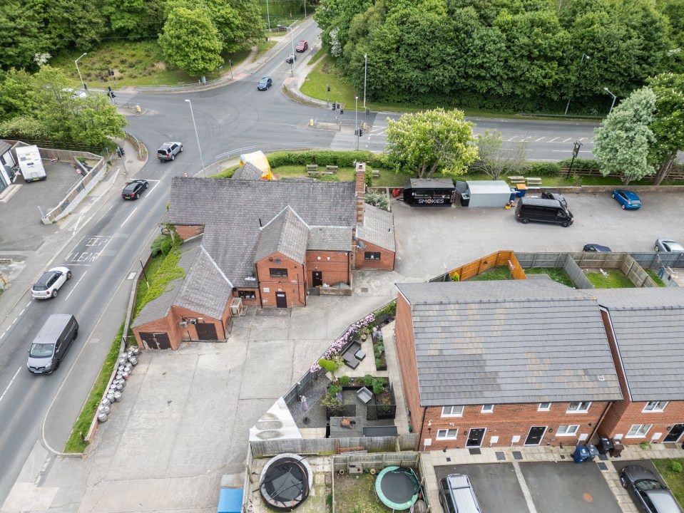 Aerial view of a smash burger van and pub, closed due to proximity to schools.
