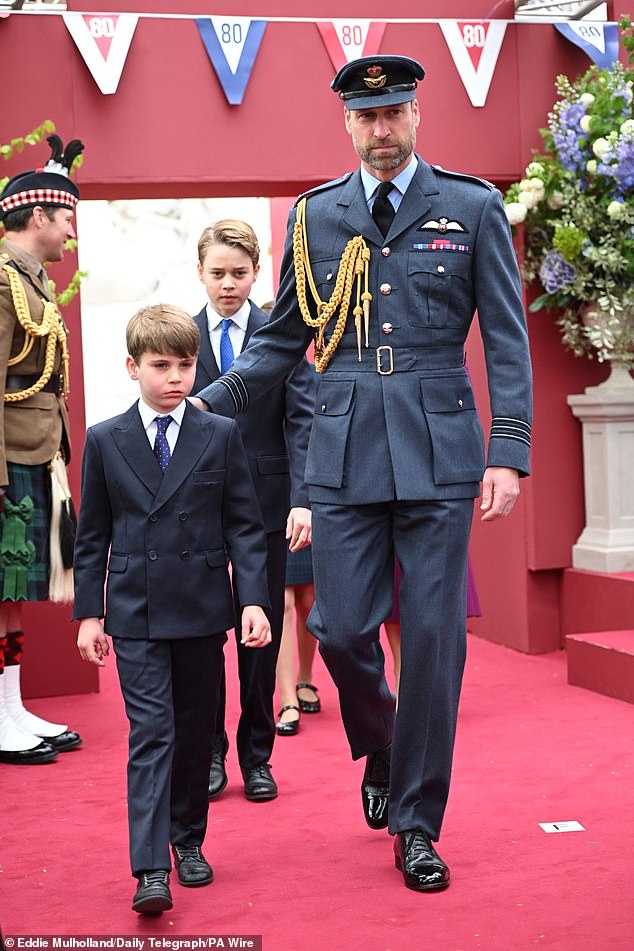 (left to right) Prince Louis, Prince George and the Prince of Wales arrive ahead of the military procession in London today
