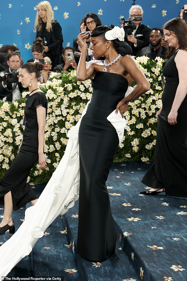 Gabrielle stunned in a black and white gown, adding a huge diamond pendant necklace