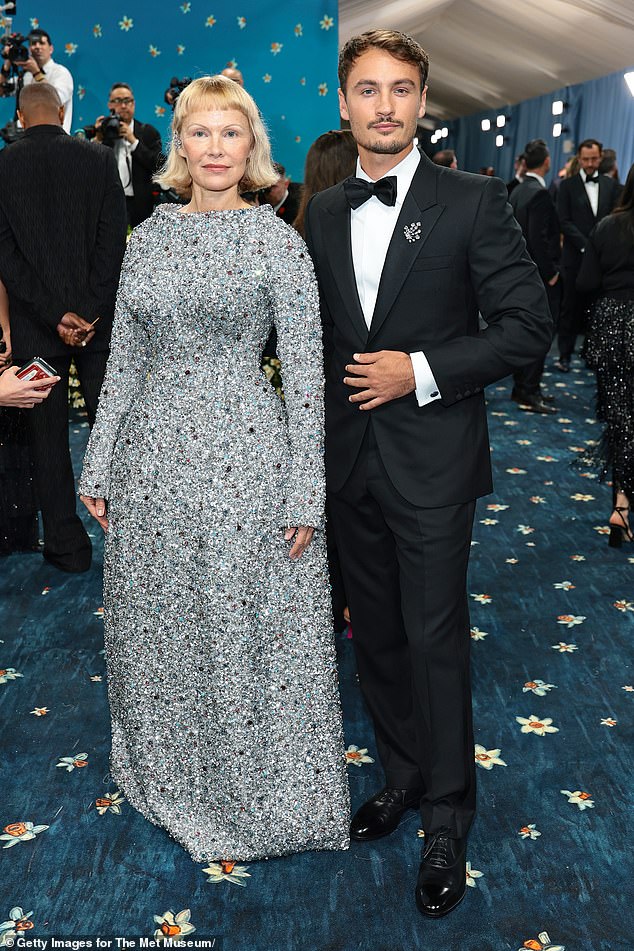 Pamela Anderson debuted a striking haircut as she posed on the red carpet with her son Brandon Thomas Lee