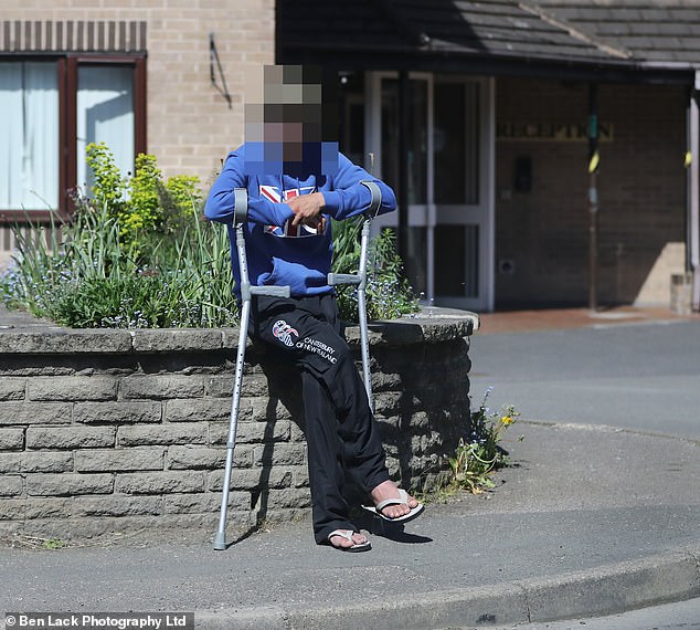 A man sitting outside the hotel in rural Derbyshire