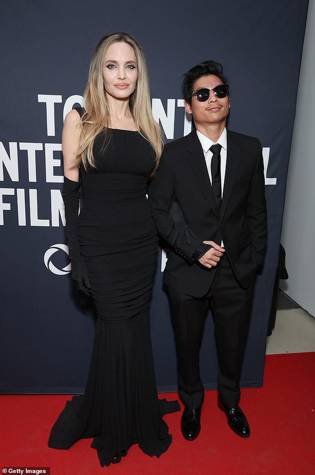 Pax, 20, (pictured here) and brother Maddox, 23, worked as assistant directors with their mom on the war drama Without Blood; Pictured in Toronto in September 2024