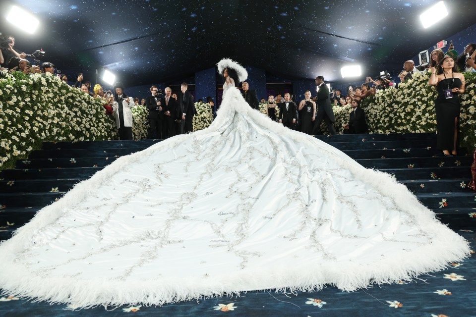 Diana Ross in a large white feathered gown at the Met Gala.
