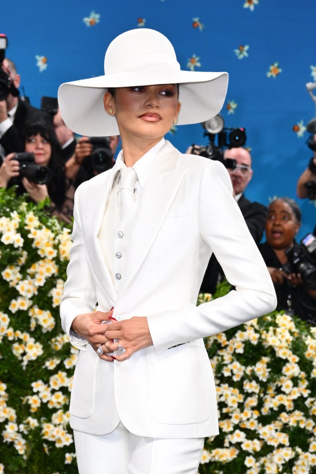 Zendaya in a white suit and hat at the Met Gala.