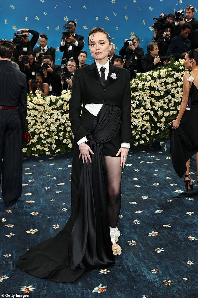 Some wondered if celebrities were 'misunderstanding' the year's theme — focused on Black dandyism — or if it accidentally encouraged 'boring' looks; Aimee Lou Wood pictured