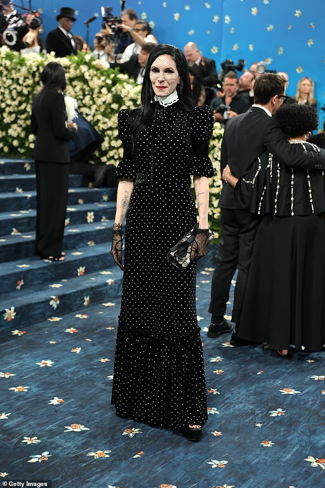 Charlotte Tilbury channeled Tim Burton in a collared black polkadot frock with a gothic black face veil