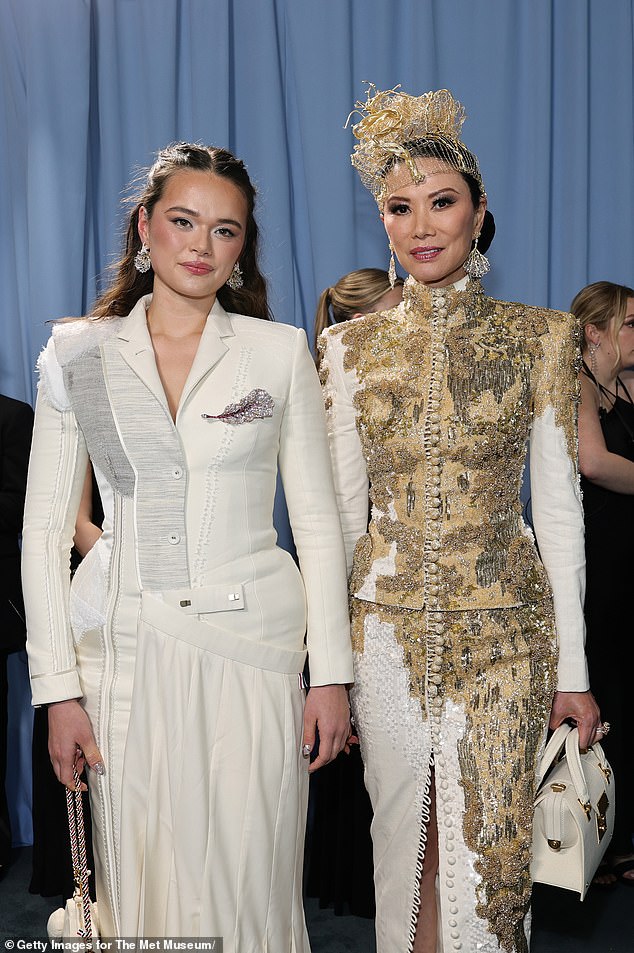 The off-white wool crepe and double duchess silk frock featured a smart lapel neckline