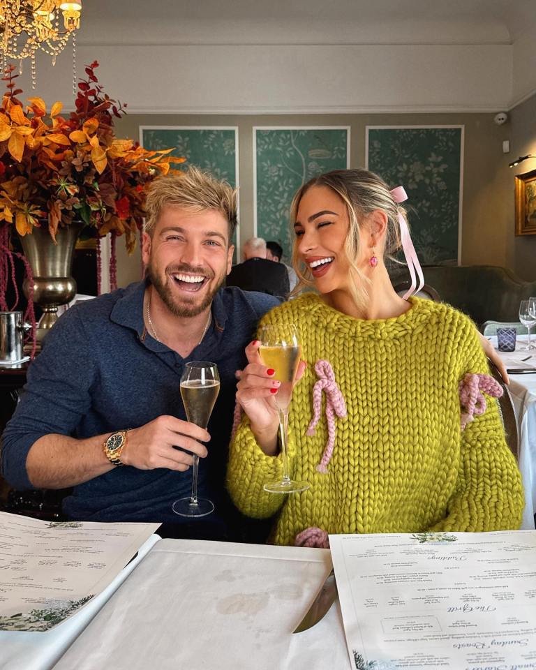 Smiling couple toasting with champagne.
