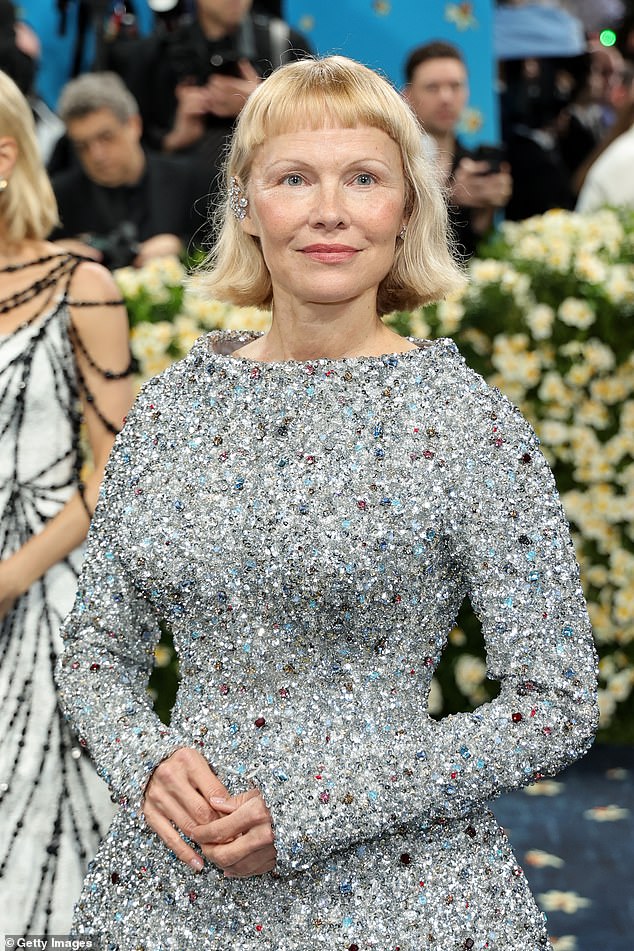 While on the red carpet Pamela revealed her glam 'only took a few minutes' calling it 'very simple'