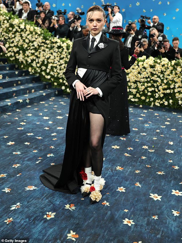 Aimee's outfit was the creation of London designer Priya Ahluwalia, according to Vogue. It featured playful touches like rumple white mid-calf socks and Cartier diamonds