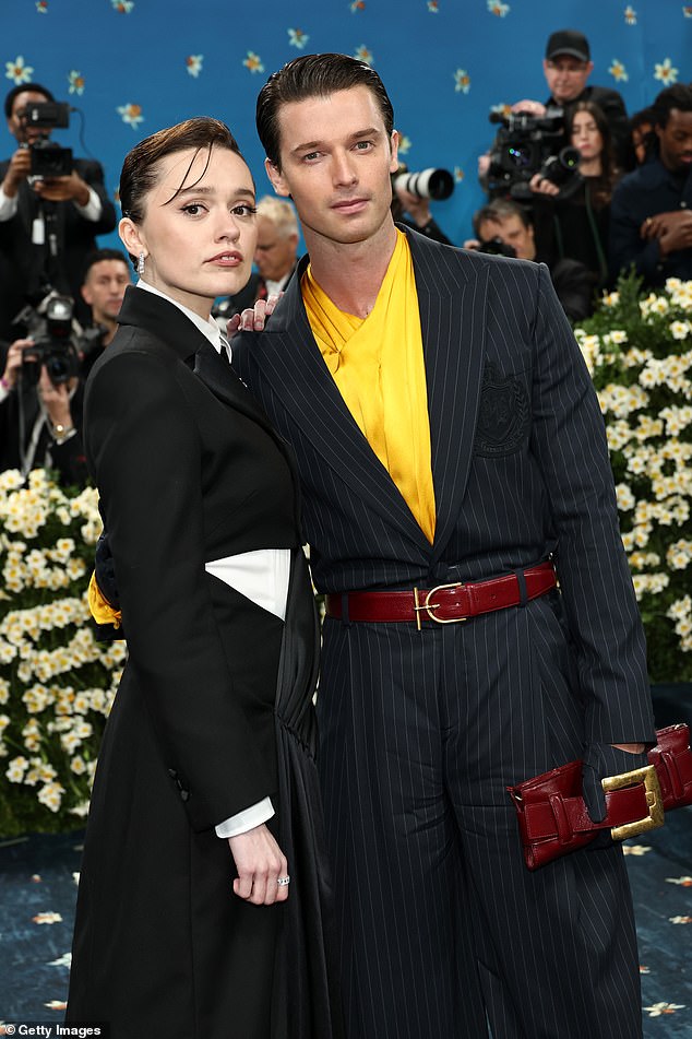 He wore an oversize black Balmain suit with pinstripes and a jacket that appeared to be tucked into his baggy trousers