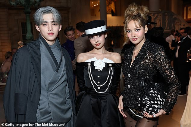 Representing K-Pop, S.Coups, Jennie, and Lisa gathered for a group shot that quickly went viral online