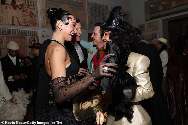 Dua Lipa shared a laugh with pal Tessa Thompson as her boyfriend Callum Turner looked on