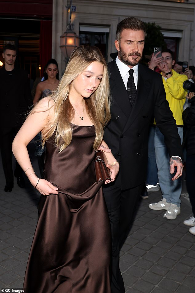It was previously stated that Brooklyn and Nicola skipped Victoria's fashion show in March because 'Kim was present at the catwalk', according to the US publication (David and Harper pictured at the event)