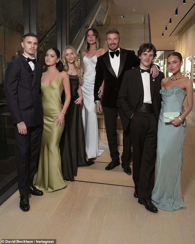 The model and aspiring DJ, 25, looks like she has always been apart of the Beckham family unit in group pictures shared of them online over the past few months (Romeo, Kim, Harper, Victoria, David, Cruz, Jackie pictured L-R)