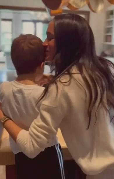 Meghan leans in and kisses Archie in a video shared on the Drew Barrymore Show