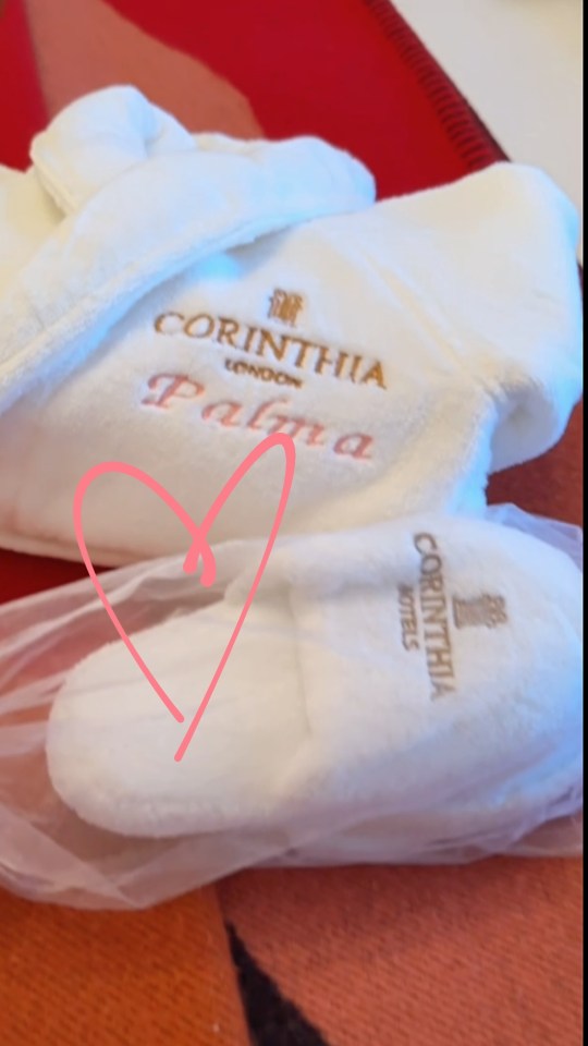 Corinthia London bathrobe and slippers with "Palma" embroidered on the robe.