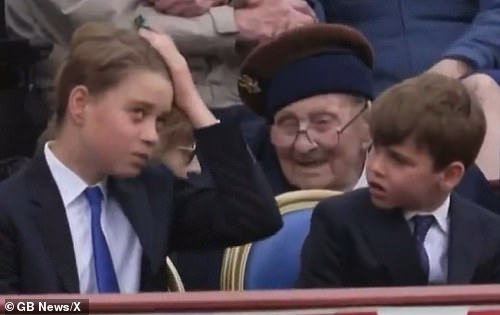 Moments earlier the seven-year-old royal observed his older brother George, 11, brushing his hair aside