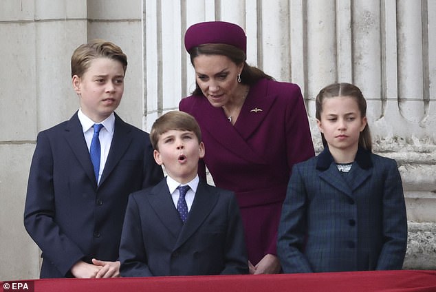 Prince Louis, seven, looked to be in high spirits as he joined his parents on the balcony yesterday