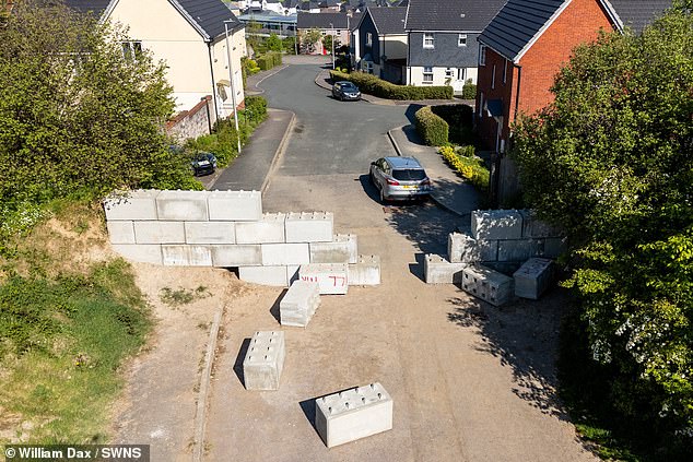 A mysterious local knocked down part of the wall with a rented JCB