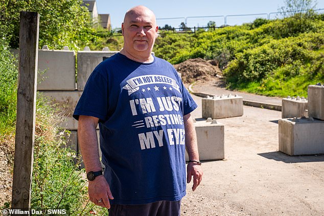 Roy Hopkinson lives right next to the hated wall. 'It's been mental', he concedes, 'I don't know why they've put it there'