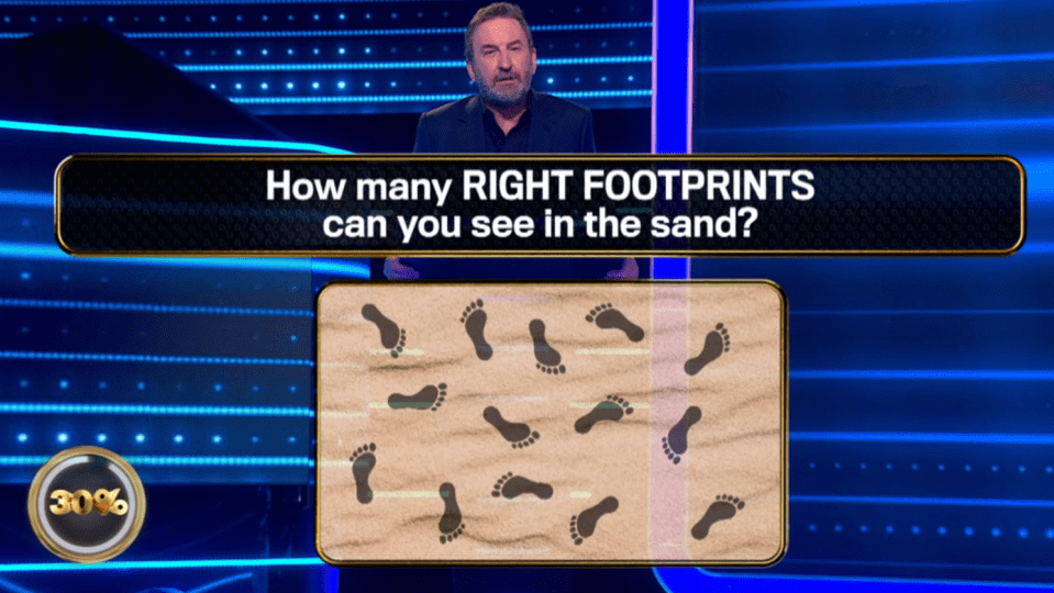 Screenshot of a game show question: How many right footprints can you see in the sand?  Sand with footprints is shown.