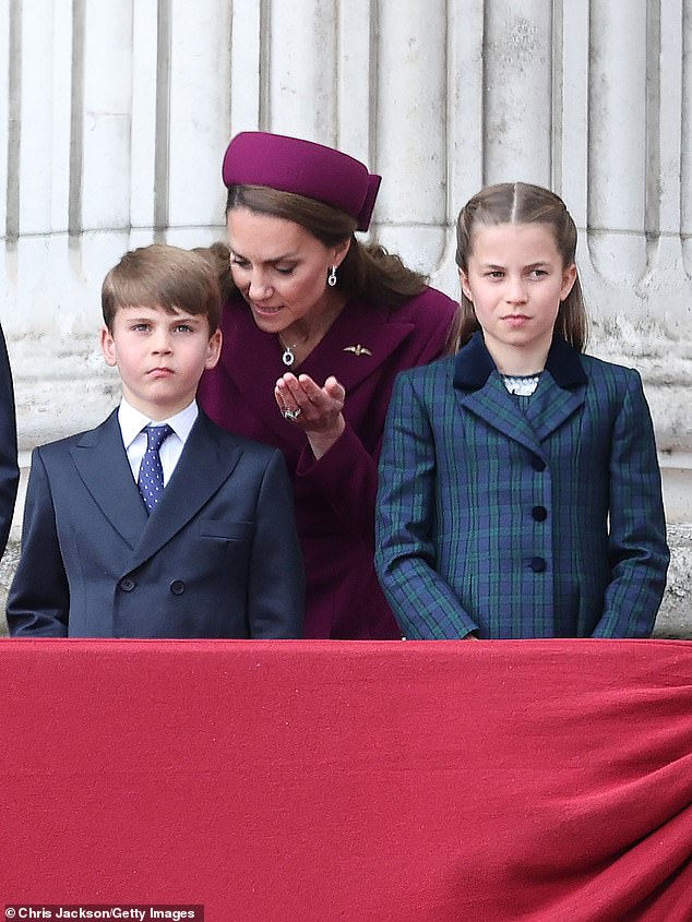 Kate appeared to chat to her youngest son as she doted on her children on the balcony this afternoon