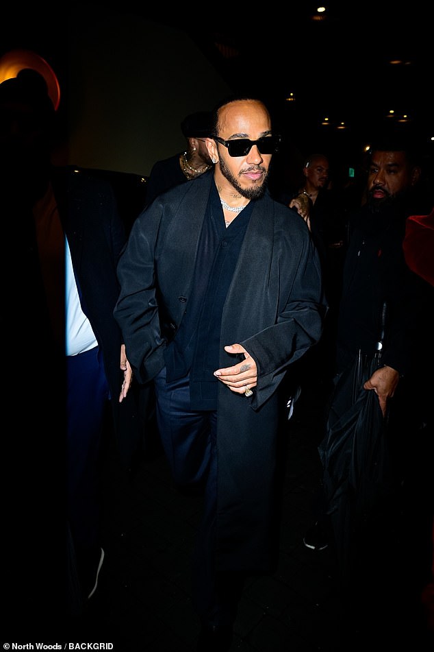 The British Formula One star, 40, switched out of his sharp white suit and matching beret in a more casual navy suit as he headed to Richard Akiva's afterparty at Casa Cipriani