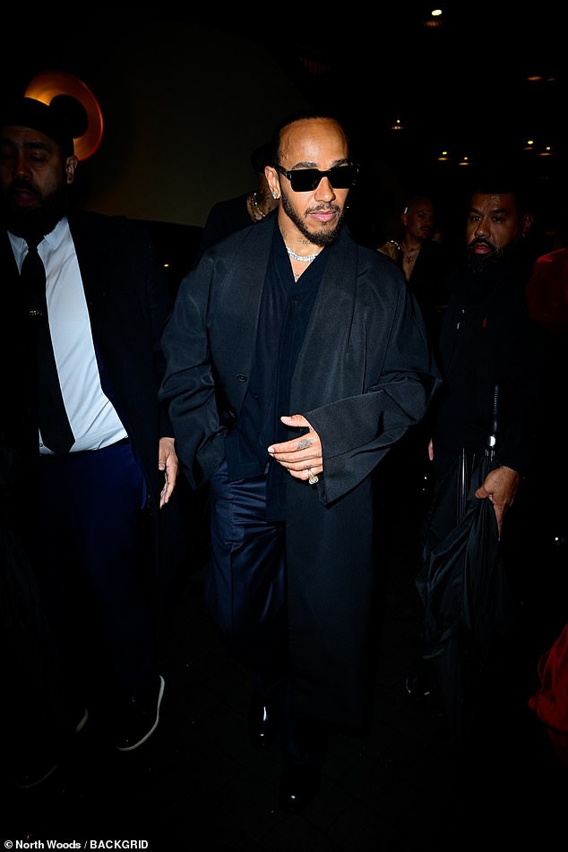 He opted for a long navy oversized coat, shirt and stylish shades as he went more casual for the afterparty event