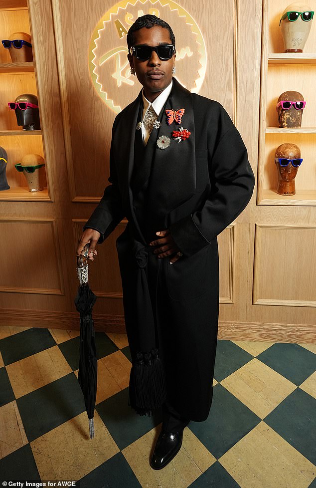 ASAP meanwhile wore a sharp suit adorned with bright pins and carried a cane with him as he appeared after his partner revealed her third pregnancy