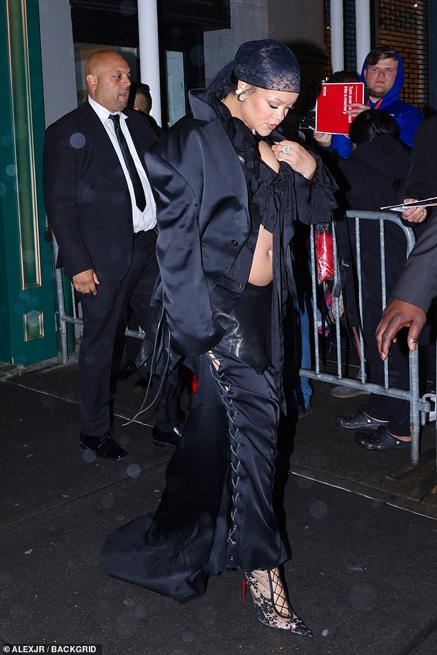 Her baby bump was visible in the outfit