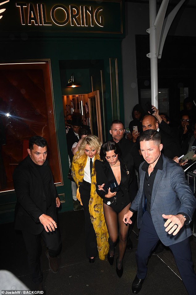 They were surrounded by their security teams