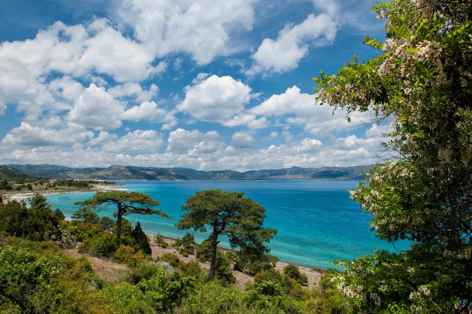 Lake Salda, Turkey, with turquoise water and a sandy shore.